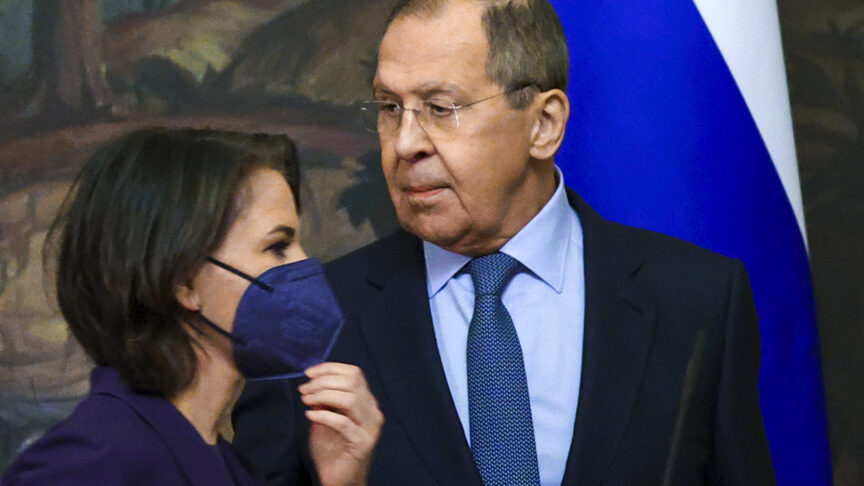 In this handout photo released by Russian Foreign Ministry Press Service, Russian Foreign Minister Sergey Lavrov and German Foreign Minister Annalena Baerbock leave a joint news conference following their talks in Moscow, Russia, Tuesday, Jan. 18, 2022. (Russian Foreign Ministry Press Service via AP)