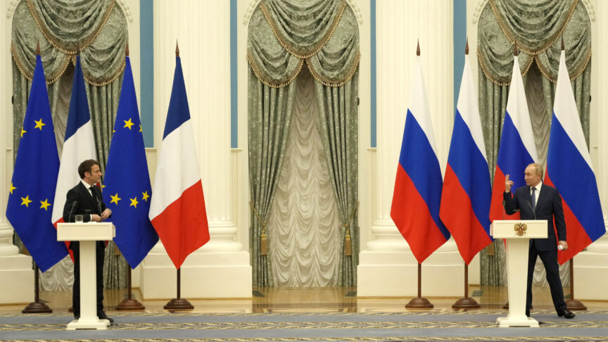 Russian President Vladimir Putin, right, gestures during a joint press conference with French President Emmanuel Macron after their talks Monday, Feb. 7, 2022 in Moscow. Russian President Vladimir Putin was back at the Kremlin in Moscow following his diplomatic foray to get support from China over the weekend during the Winter Olympics. Putin was hosting the prime meeting of the day Monday as his French counterpart Emmanuel Macron was on a mission to de-escalate tensions. (AP Photo/Thibault Camus, Pool)