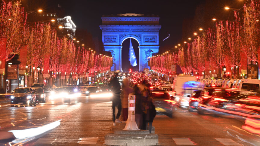 PARIS, FRANCE – JANUARY 01: Arc de Triomphe is pictured from The Avenue des Champs-Elysees as illuminated in the color of the European Union flag to mark of France presidency of the EU in Paris, France on January 01, 2022 Antonio Borga / Anadolu Agency
