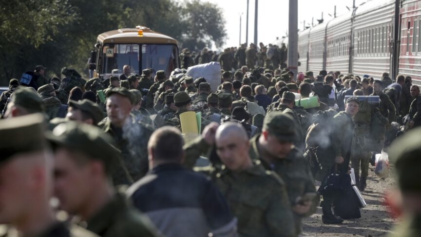 Russian recruits gather to take a train at a railway station in Prudboi, Volgograd region of Russia, Thursday, Sept. 29, 2022. Russian President Vladimir Putin has ordered a partial mobilization of reservists to beef up his forces in Ukraine. (AP Photo)