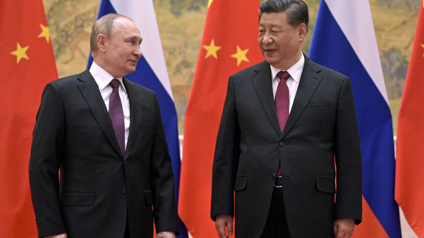 Chinese President Xi Jinping, right, and Russian President Vladimir Putin talk to each other during their meeting in Beijing, China, Friday, Feb. 4, 2022. Putin on Friday arrived in Beijing for the opening of the Winter Olympic Games and talks with his Chinese counterpart Xi Jinping, as the two leaders look to project themselves as a counterweight to the U.S. and its allies. (Alexei Druzhinin, Sputnik, Kremlin Pool Photo via AP)