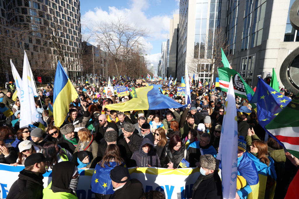 People march after gathering at Northern train station (Gare du Nord) to show solidarity with Ukraine and its people, on the first anniversary of the war between Russia - Ukraine in Brussels, Belgium on February 25, 2023. One year has passed since the start of Russia's war with Ukraine.