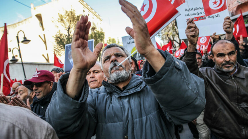 Demonstrators shout slogans while waving flags of Tunisia, during a demonstration held by the National Salvation Front opposition alliance, in Tunis, Tunisia, on March 5, 2023, to call for the release of arrested and detained opposition figures deemed critical of President Kais Saied