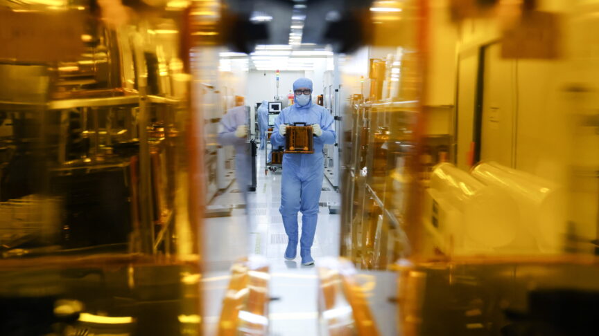 9 February 2023: A member of staff handles SMIF pods in the clean zone of a Mikron microchip production facility in Zelenograd. A Russian manufacturer of microelectronic components for e-passports, Mikron is currently upgrading its equipment to satisfy an increased demand for microchips. Earlier, Goznak announced it had temporarily suspended issuing newer external passports valid for ten years, for the same reason. Anton Novoderezhkin/TASS]