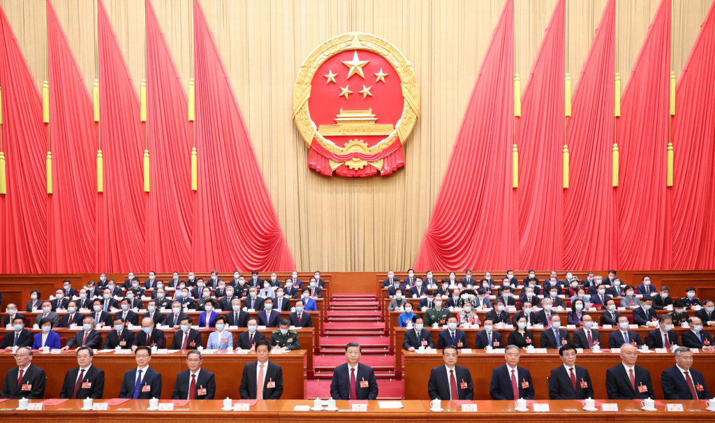 China's President Xi Jinping (C) and other Chinese leaders attend the closing meeting of the first session of the 14th National People's Congress (NPC) at the Great Hall of the People in Beijing, China, 13 March 2023.