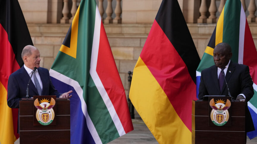 German Chancellor Olaf Scholz, left, speaks during a joint press conference with South Africa President Cyril Ramaphosa at the Union Building in Pretoria, South Africa, Tuesday, May 24, 2022. (AP Photo/Themba Hadebe)