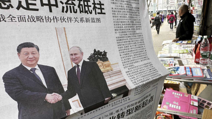 A photo shows the newspaper reporting about the meeting between Chinese President Xi Jinping and Russian President Vladimir Putin in Beijing, China on March 21, 2023. Xi Jinping has visited to hold a meeting with Russian President Vladimir Putin.( The Yomiuri Shimbun via AP Images )