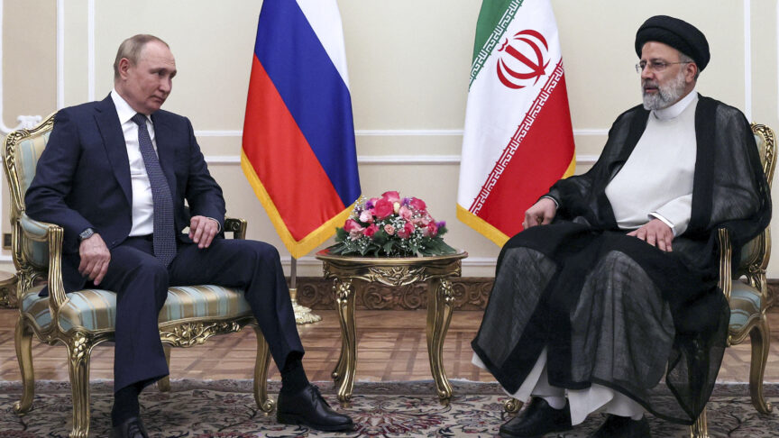 Russian President Vladimir Putin, left, and Iranian President Ebrahim Raisi pose for a photo prior to their talks at the Saadabad palace, in Tehran, Iran, Iran, Tuesday, July 19, 2022. (Sergei Savostyanov, Sputnik, Kremlin Pool Photo via AP)