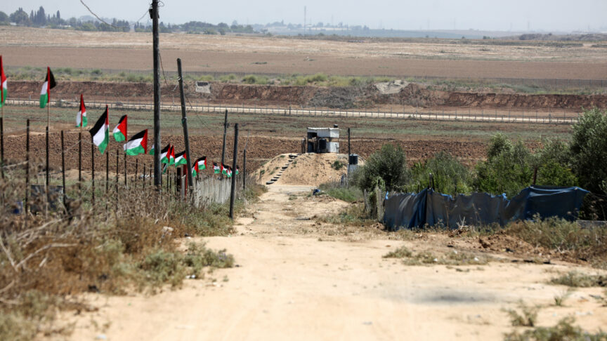 Palestinian flags fly near the border between the Gaza Strip and Israel near an observation point manned by Hamas fighters east of Jabalia on August 30, 2023. (Photo by Majdi Fathi/NurPhoto)