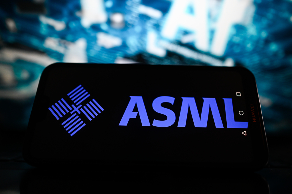In this photo illustration, an ASML logo is displayed on a smartphone with Artificial Intelligence graphics in the background.