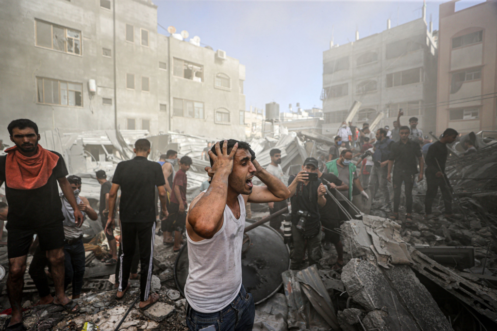 Civil defense teams and locals carry out search and rescue operations after an Israeli attack hits Shaqwra family apartment in Khan Yunis, Gaza on November 06, 2023.