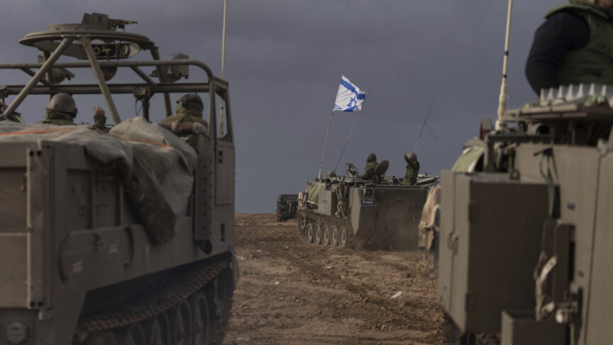 Israeli soldiers manoeuver armored military vehicles along Israel’s border with the Gaza Strip, in southern Israel, on Monday, Nov. 20, 2023. The Israeli military has deployed hundreds of thousands of troops in and around Gaza as it conducts a ground offensive against Hamas militants inside the territory. (AP Photo/Ohad Zwigenberg)