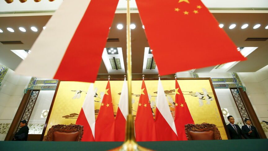 Poland and Chinese flags remain on the podium after a singing ceremony attended by countries presidents at the Great Hall of the People in Beijing November 25, 2015. REUTERS/Damir Sagolj || Editorial use only