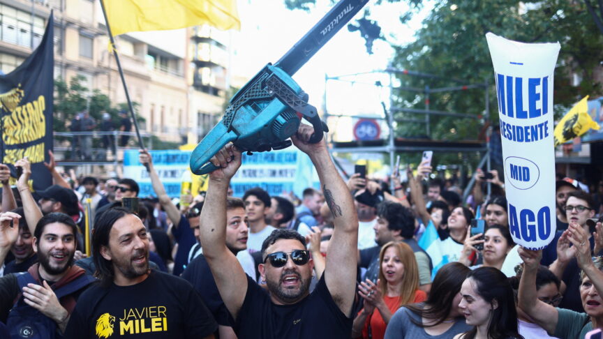 A supporter of Argentine presidential candidate Javier Milei holds a fake chainsaw during the closing event of Milei’s electoral campaign ahead of the November 19 runoff election, in Cordoba, Argentina, November 16, 2023. REUTERS/Matias Baglietto