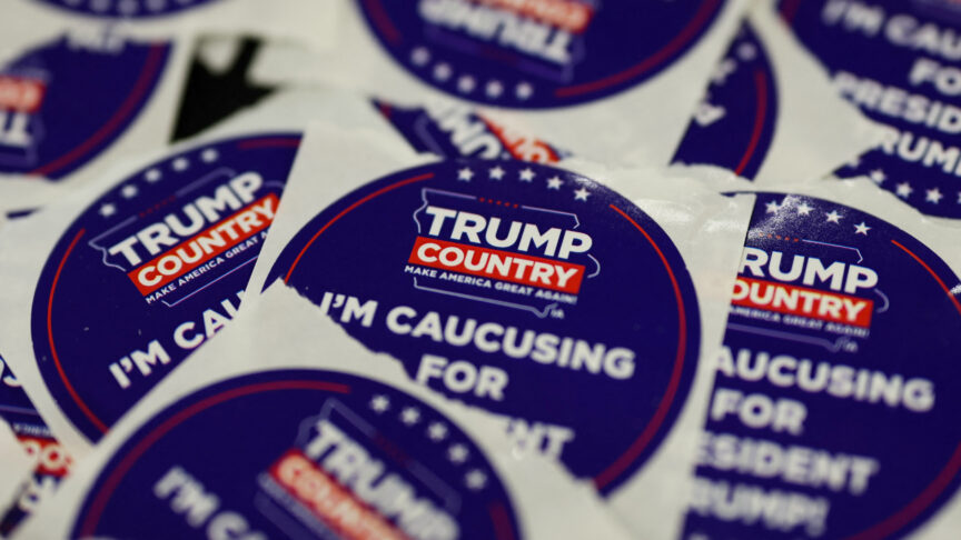 Stickers in support of former U.S. President and Republican presidential candidate Donald Trump are displayed at a table on the day he campaigns in Indianola, Iowa, U.S., January 14, 2024. REUTERS/Brendan McDermid