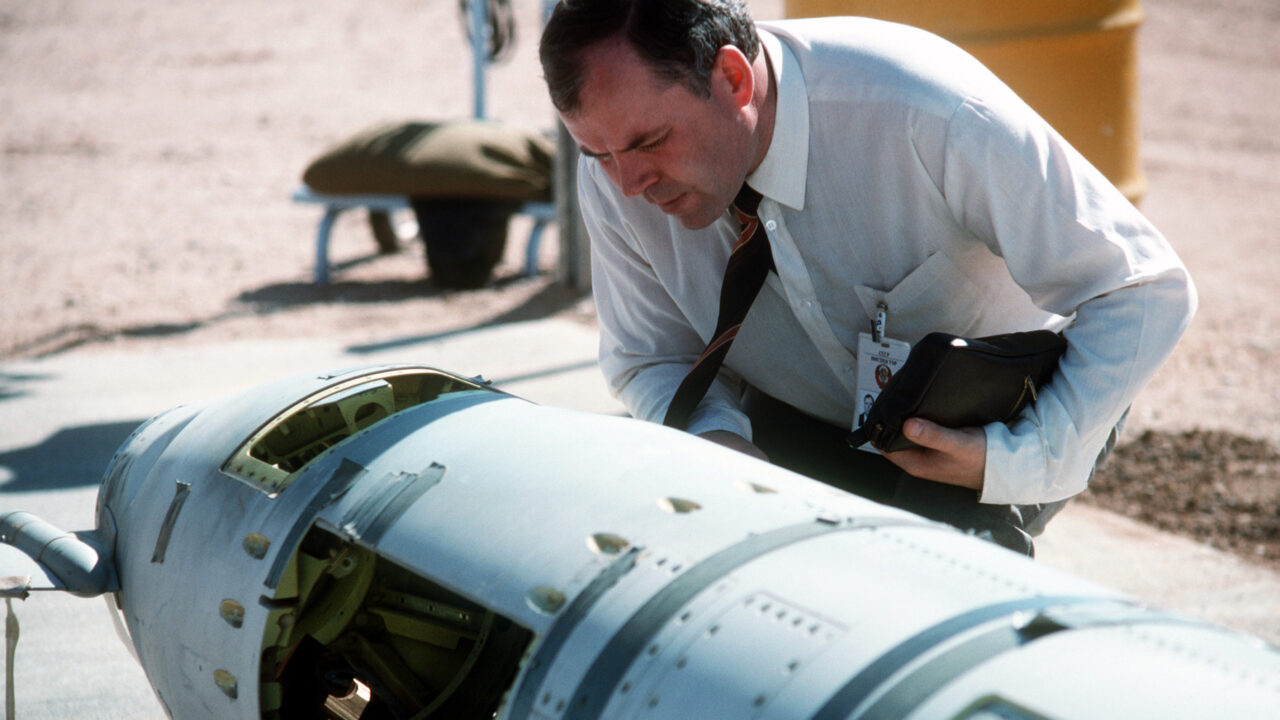 A Soviet inspector examines a BGM-109G Tomahawk ground launched cruise missile (GLCM) prior to its destruction.  Forty-one GLCMs and their launch canisters and seven transporter-erector-launchers are being disposed of at the base in the first round of reductions mandated by the Intermediate Range Nuclear Forces Treaty