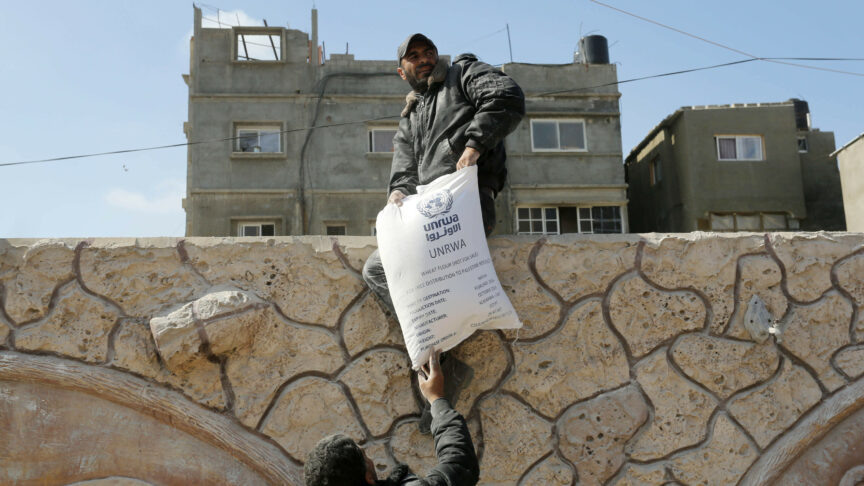 DEIR AL-BALAH, GAZA – MARCH 03: Palestinians flock to receive flour distributed by The United Nations Relief and Works Agency for Palestinian Refugees in the Near East (UNRWA) in Gaza, where there is a food crisis due to Israeli attacks in Deir Al-Balah, Gaza on March 03, 2024. A large number of Palestinians who wanted to benefit from the distributions crowded the distribution center in the city of Deir Belah. As the food crisis escalates in Gaza due to Israeli attacks, the United Nations Relief and Works Agency for Palestinian Refugees in the Near East (UNRWA) distribute essential flour supplies. Ashraf Amra / Anadolu