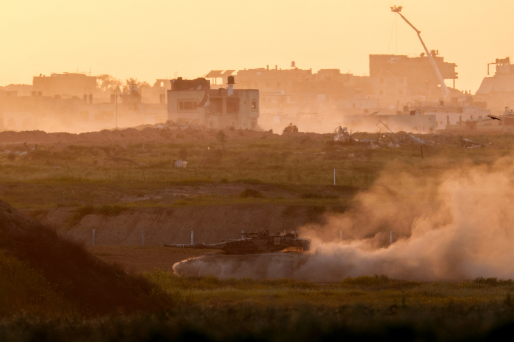 A tank manouvers along the Israeli side of the Israel-Gaza border fence, amid the ongoing conflict between Israel and the Palestinian Islamist group Hamas, as seen from southern Israel, Israel March 3, 2024.