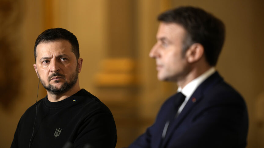 French President Emmanuel Macron, right, and his Ukrainian counterpart Volodymyr Zelenskyy attend a joint press conference after signing an agreement, Friday, Feb. 16, 2024 at the Elysee Palace in Paris. Ukrainian President Volodymyr Zelenskyy arrived in Paris to sign a bilateral security agreement with France hours after he officialized a similar one with Germany. The agreements send a strong signal of long-term backing as Kyiv works to shore up Western support nearly two years after Russia launched its full-scale war. (AP Photo/Thibault Camus, Pool)
