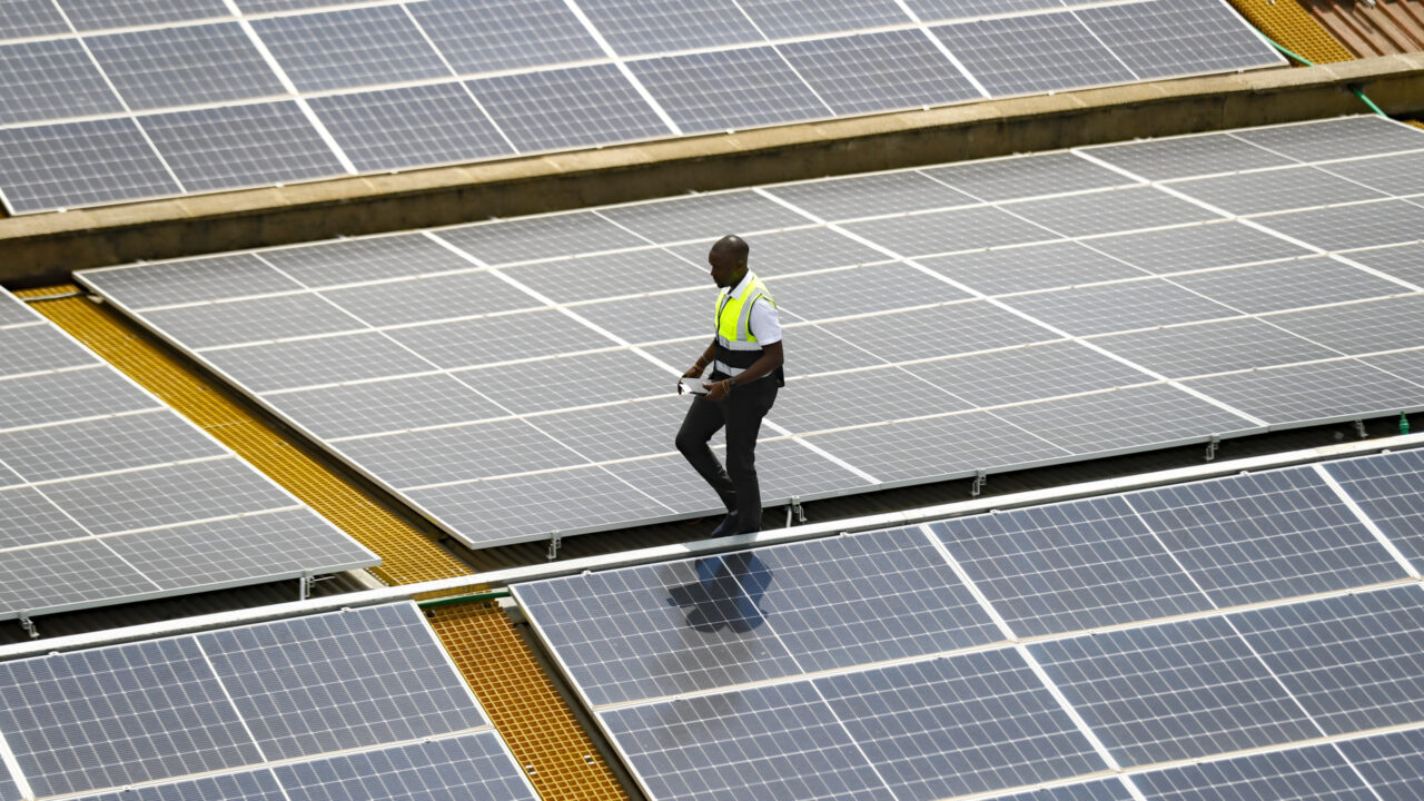 Mark Munyua, CP solar’s technician, examines solar panels on the roof of a company in Nairobi, Kenya, Friday, Sept. 1, 2023. Access to electricity remains a major challenge for over half a billion people in sub-Saharan Africa, and power outages are common