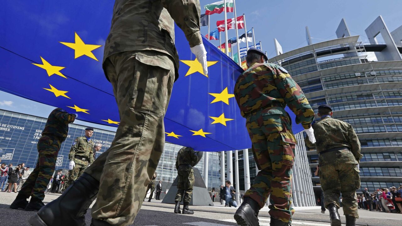Soldiers of the Eurocorps hold the European flag during a ceremony in front of the European Parliament in Strasbourg, June 30, 2014