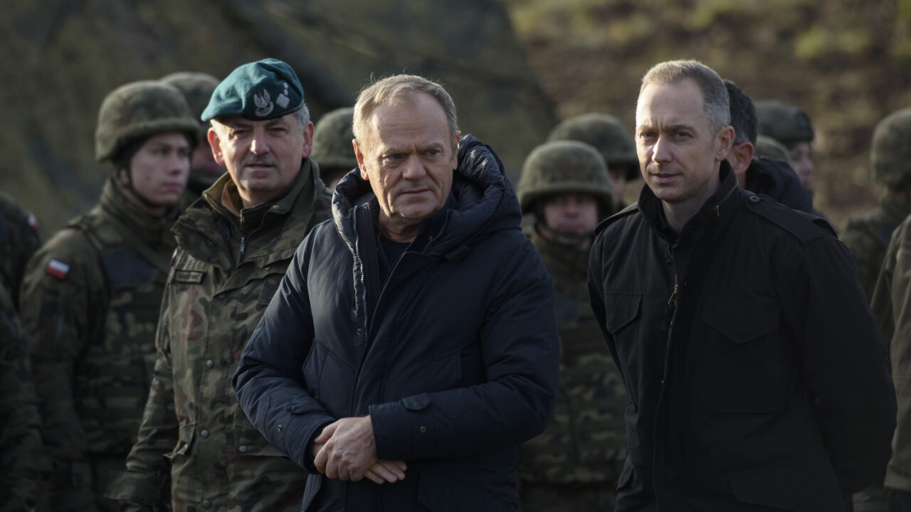 Polish Prime Minister Donald Tusk (left) and Deputy Minister of National Defense Cezary Tomczyk (right) talk before a press conference in Dabrowka, Poland, on November 30, 2024. The East Shield programme comprises a complex of barriers, fortifications, and state-of-the-art airspace monitoring systems designed to guard Poland’s northern and eastern borders. According to the existing plans, the fortifications encompass Podlasie, Lublin, Warmia-Masuria, and parts of Masovia voivodeships. The cost of the entire programme is estimated at PLN 10 billion, with construction work expected to be completed by 2028. (Photo by Aleksander Kalka/NurPhoto)