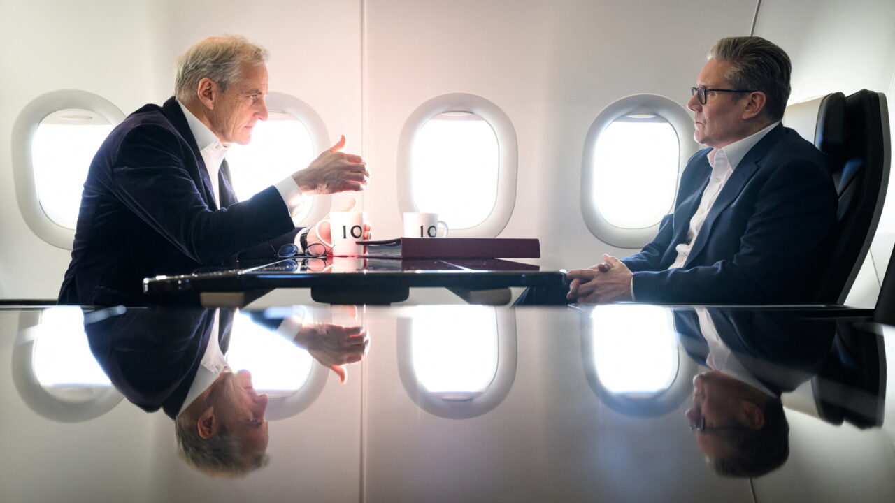 British Prime Minister Keir Starmer talks with Norwegian Prime Minister Jonas Gahr Stoere as they travel on board the British delegation aircraft to Estonia, on December 16, 2024. Leon Neal/Pool via REUTERS