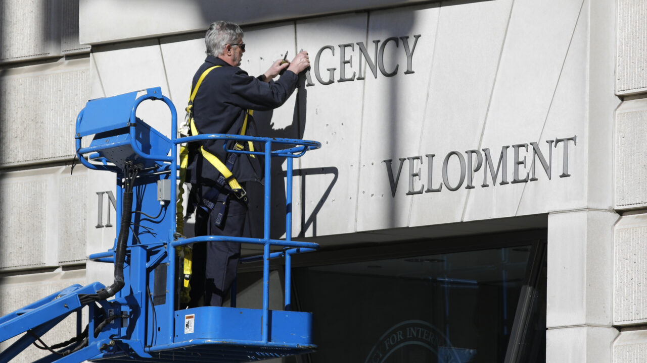February 7, 2025, Washington, District of Columbia, USA: A worker removes the signage outside the United States Agency for International Aid (USAID) building after President Trump and Musk called for it to be shuttered, spurring outcry from Democrats in Congress. (Credit Image: Â© Mark Alfred/ZUMA Press Wire