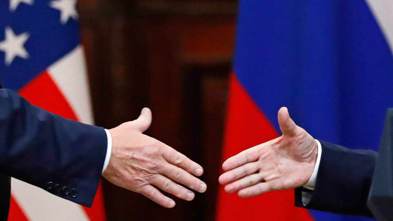 FILE – U.S. President Donald Trump shakes hands with Russian President Vladimir Putin at the end of a news conference following their meeting at the Presidential Palace in Helsinki, Finland, on July 16, 2018. (AP Photo/Alexander Zemlianichenko, File)