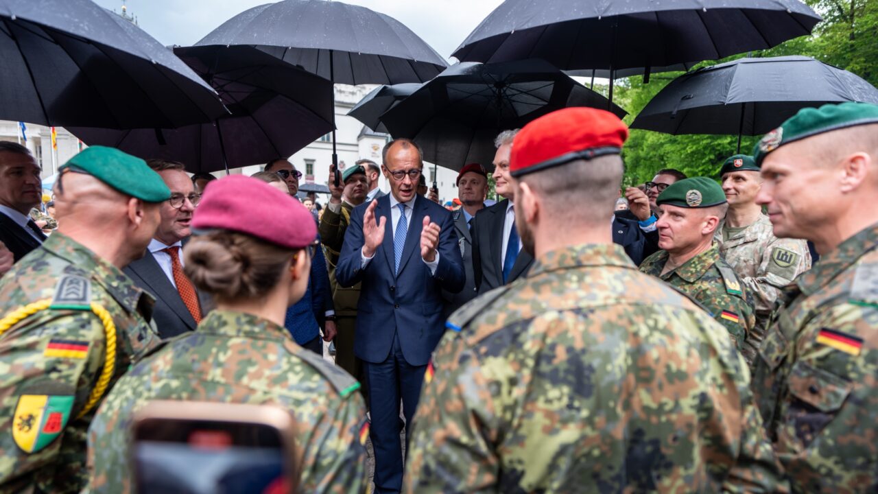 German Chancellor Friedrich Merz (centre) standing next to Gitanas Nauseda (centre right), president of Lithuania, and Boris Pistorius (second from left), German Defence Minister, with soldiers from the German Army’s 45th Tank Brigade