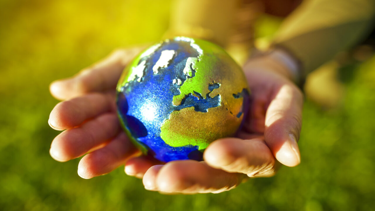 Hands Holding Globe, Climate Protection