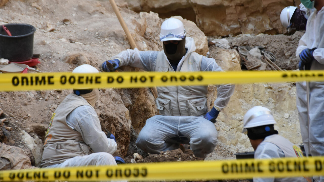 MOSUL, IRAQ – JULY 13: Workers begin to exhume the remains of bodies from a mass grave, presumably where Turkmens from Tal Afar who were killed between 2014 and 2017 and thrown into the what is called the ‘massacre pit’ when Daesh/ISIS was in control of the region, near Tal Afar district of Mosul, Iraq on July 13, 2024