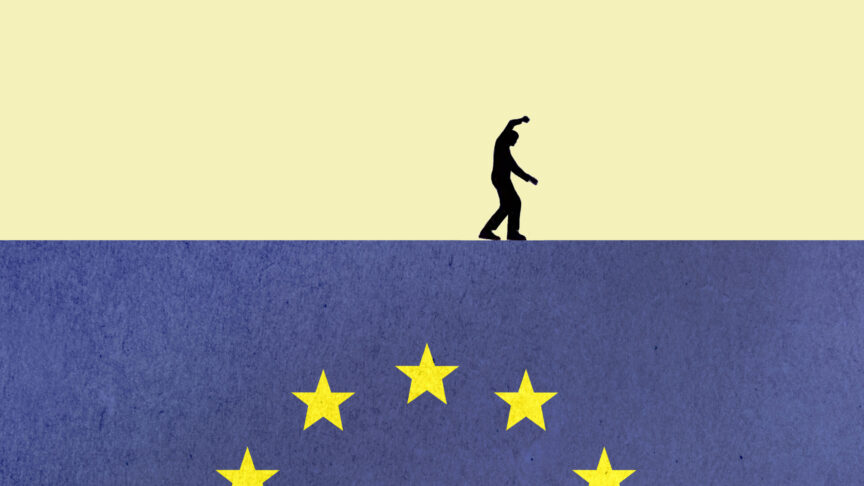 Silhouette of a person walking on a European Union flag symbolizing political and economic uncertainty