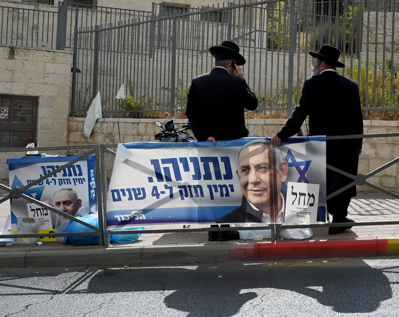A campaign banner for Binyamin Netanyahu hangs outside a polling station in the Har Homa settlement on November 1st 2022