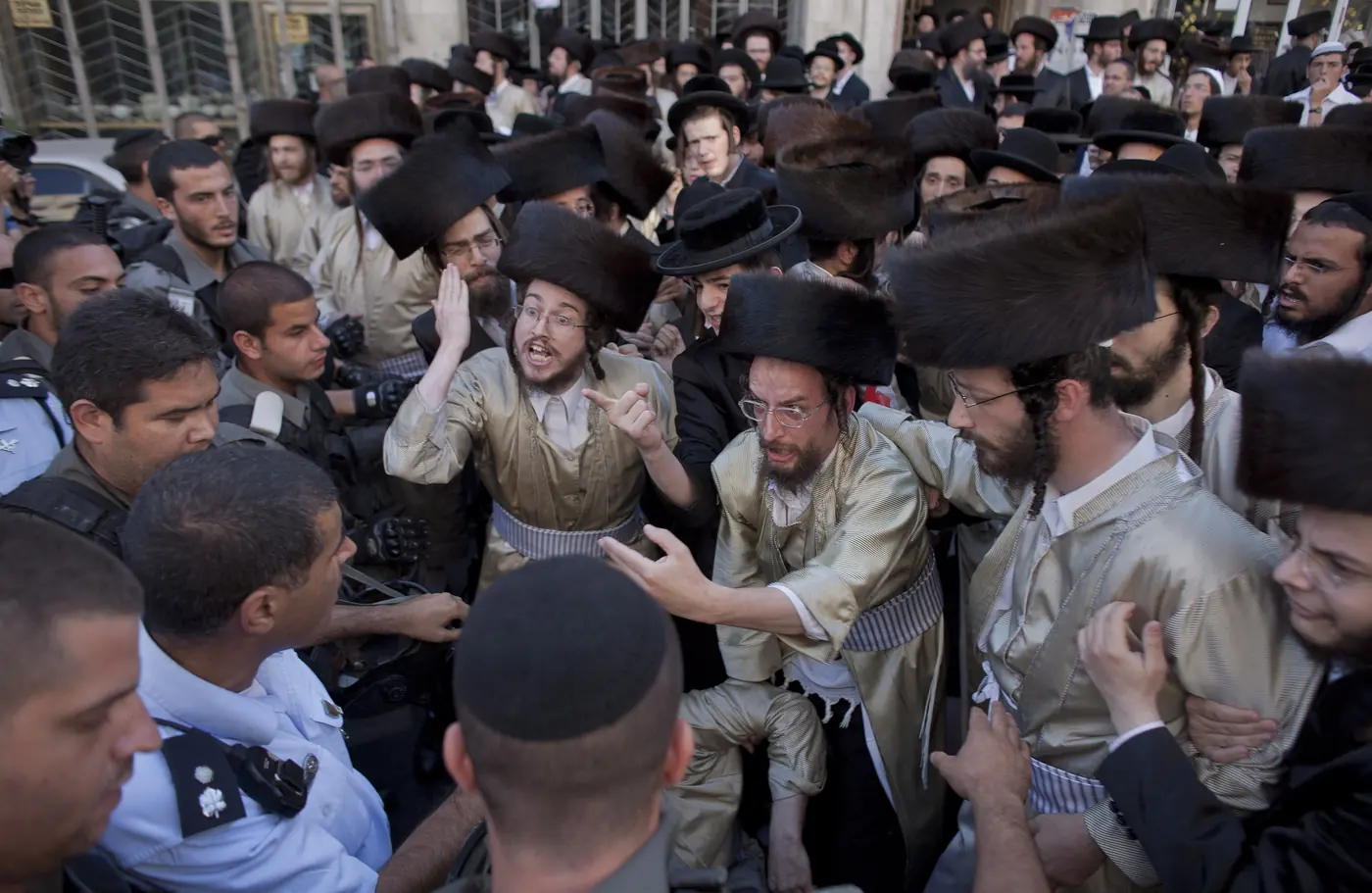 Ultra-Orthodox men clash with Israeli border police during a demonstration in Jerusalem against the opening of a parking lot on Shabbat, July 16th 2011