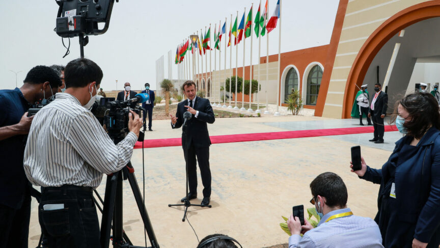 French President Emmanuel Macron speaks to the press upon arrival at Nouakchott Oumtounsy International Airport Tuesday June 30, 2020, in Nouakchott, to attend a G5 Sahel summit.  (Ludovic Marin, Pool via AP)