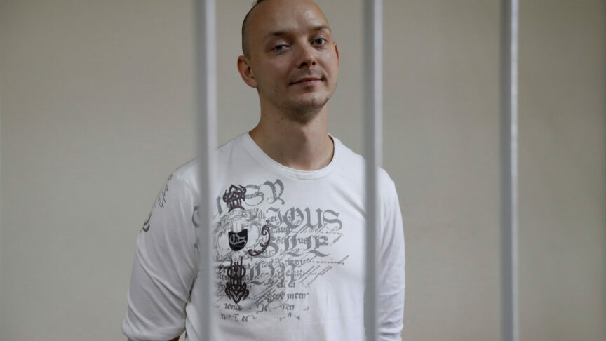Ivan Safronov, a former journalist and an aide to the head of Russia’s space agency Roscosmos who remains in custody on state treason charges, stands inside a defendants’ cage as he attends a court hearing in Moscow, Russia September 2, 2020